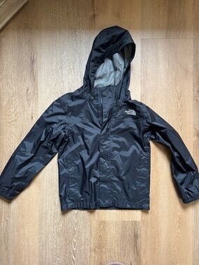 North Face zip line rain coat with hood.  Black size small 7/8. Great condition.